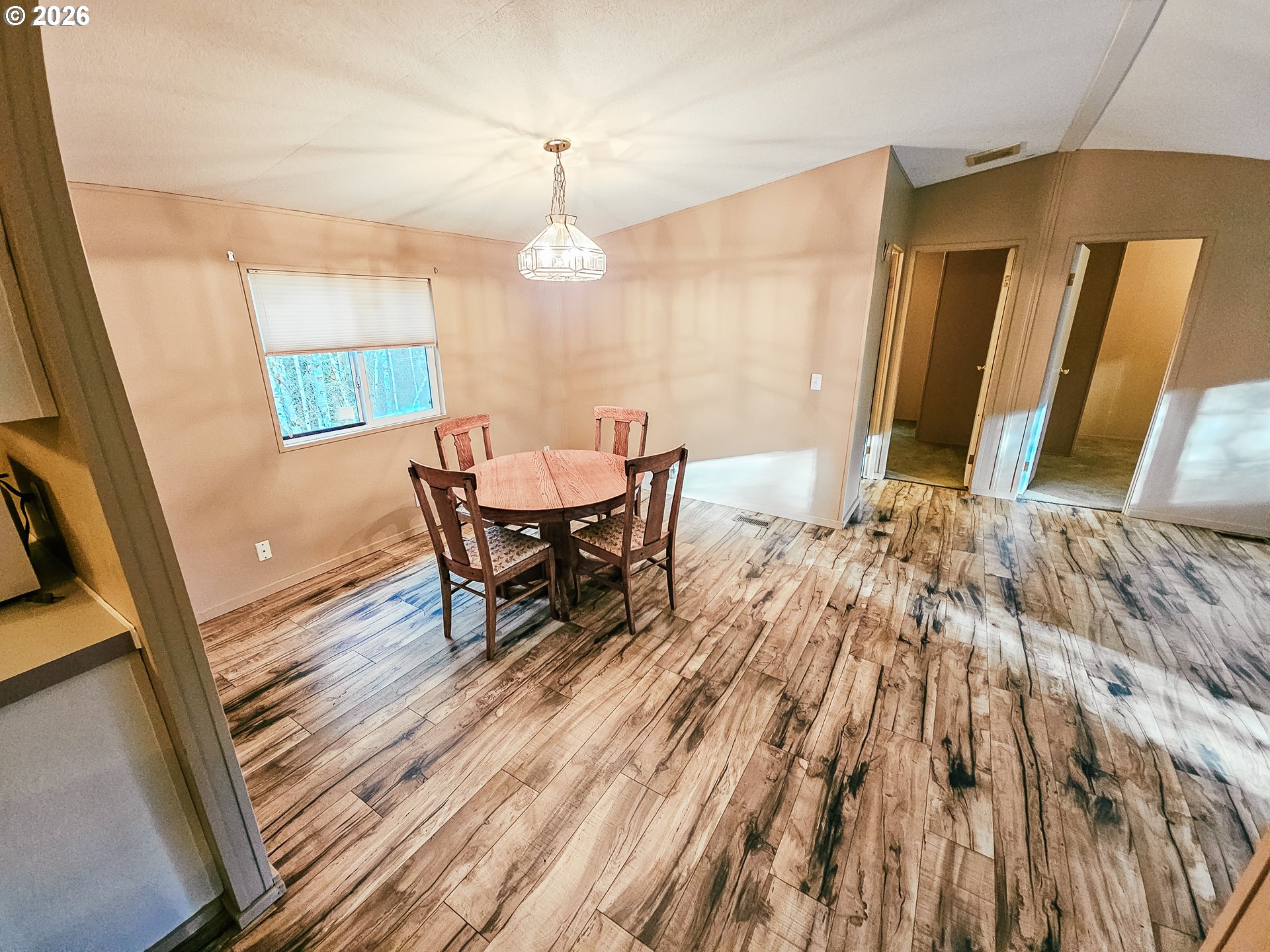 295 Easy Street Road Silverlake, WA 98645 - Photo 19 of 42 a view of a dining room with furniture and wooden floor