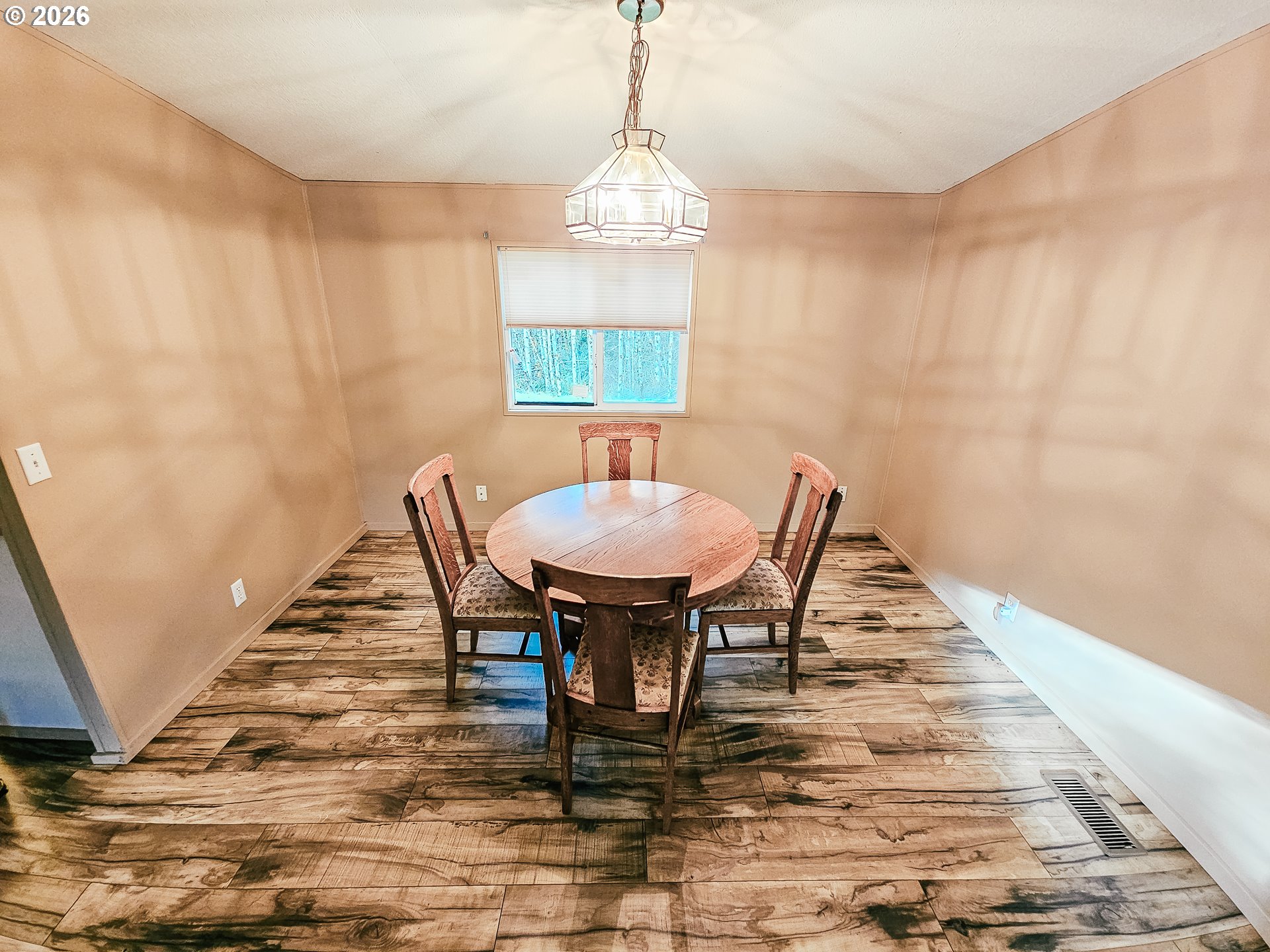295 Easy Street Road Silverlake, WA 98645 - Photo 20 of 42 a view of a dining room with furniture and wooden floor