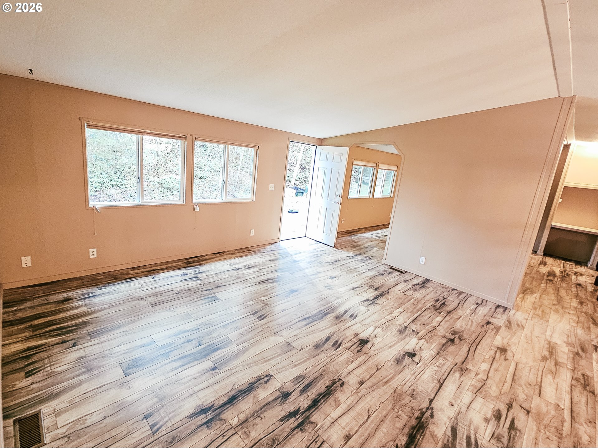 295 Easy Street Road Silverlake, WA 98645 - Photo 2 of 42 a view of a livingroom with wooden floor and a window