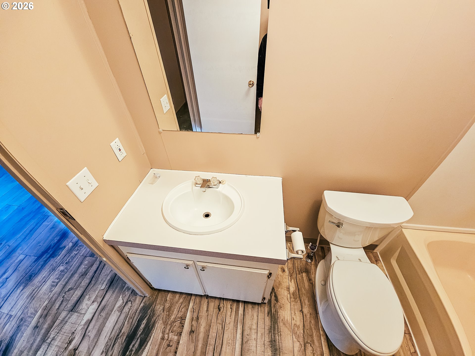 295 Easy Street Road Silverlake, WA 98645 - Photo 25 of 42 a bathroom with a toilet a sink and a mirror