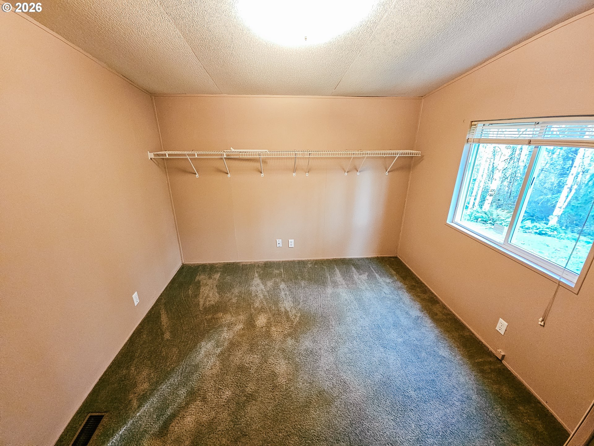 295 Easy Street Road Silverlake, WA 98645 - Photo 29 of 42 a view of a room with wooden floor and window
