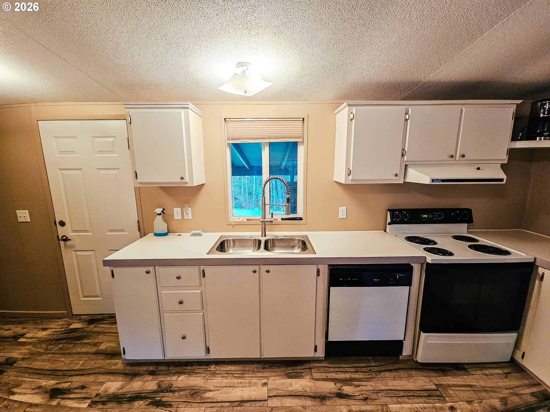 295 Easy Street Road Silverlake, WA 98645 - Photo 4 of 42 a kitchen with stainless steel appliances granite countertop a sink stove and cabinets