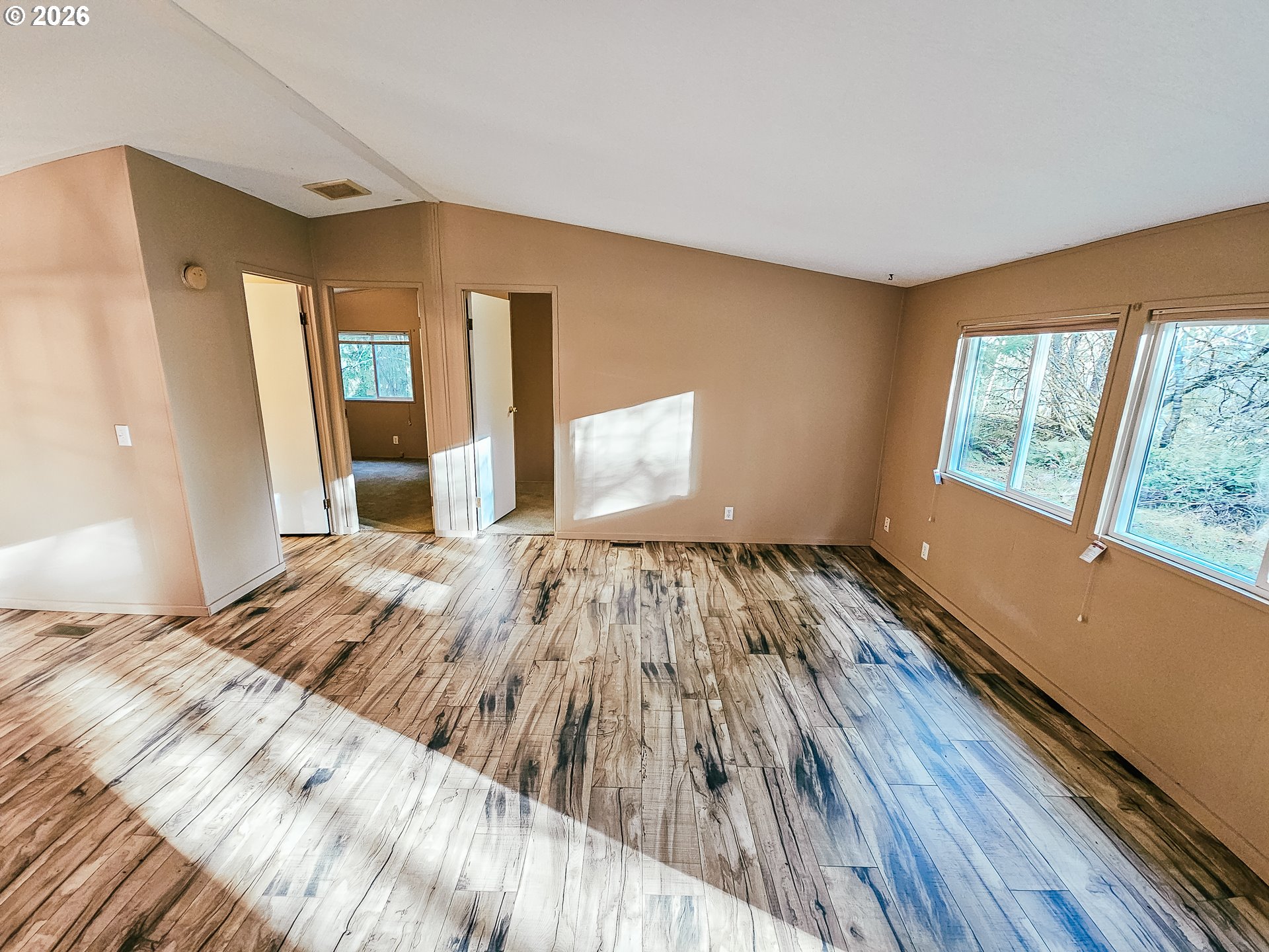 295 Easy Street Road Silverlake, WA 98645 - Photo 42 of 42 a bedroom with a bed and wooden floor