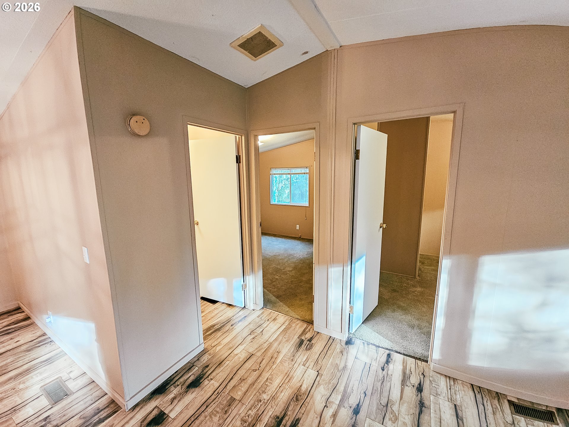 295 Easy Street Road Silverlake, WA 98645 - Photo 6 of 42 a view of a hallway with wooden floor and staircase