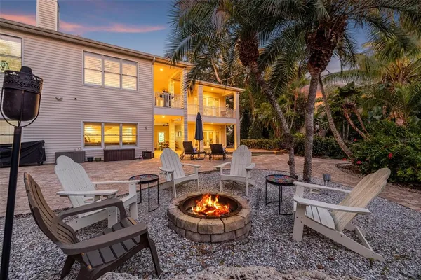 a backyard of a house with outdoor seating