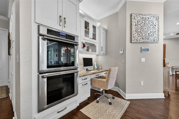a work place with a stove and a refrigerator