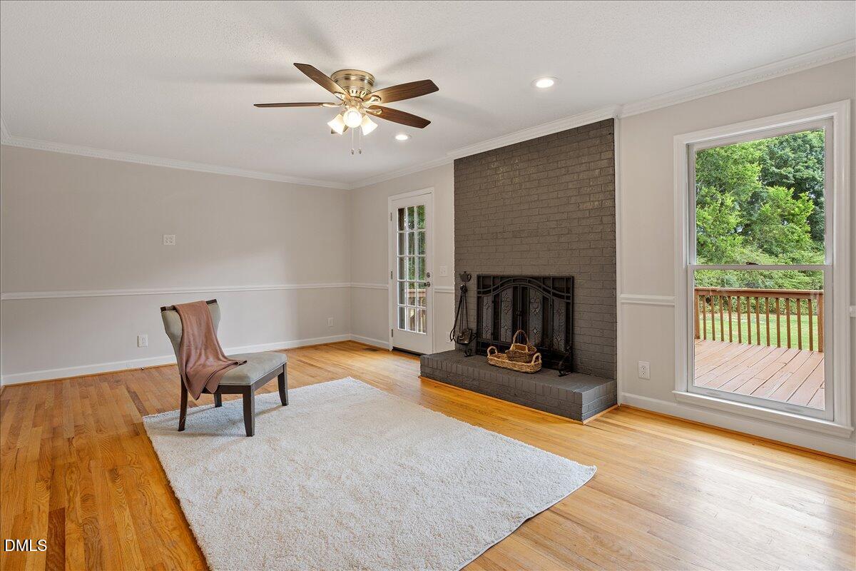 805 Rand Road Garner, NC 27529 - Photo 16 of 38 a living room with furniture and a fireplace
