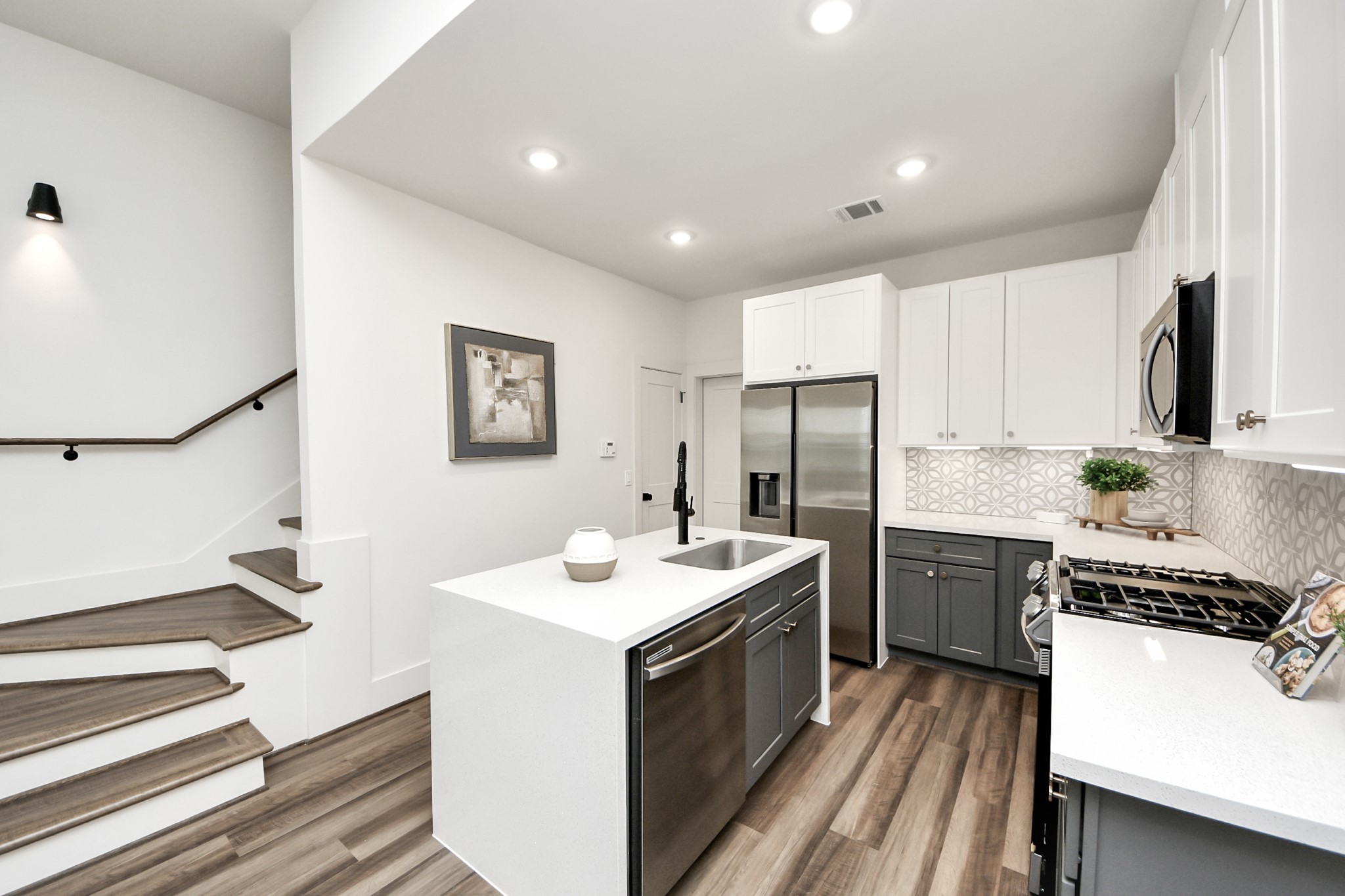6018 Knox Street Houston, TX 77091 - Photo 14 of 42 a kitchen with a sink stove and refrigerator