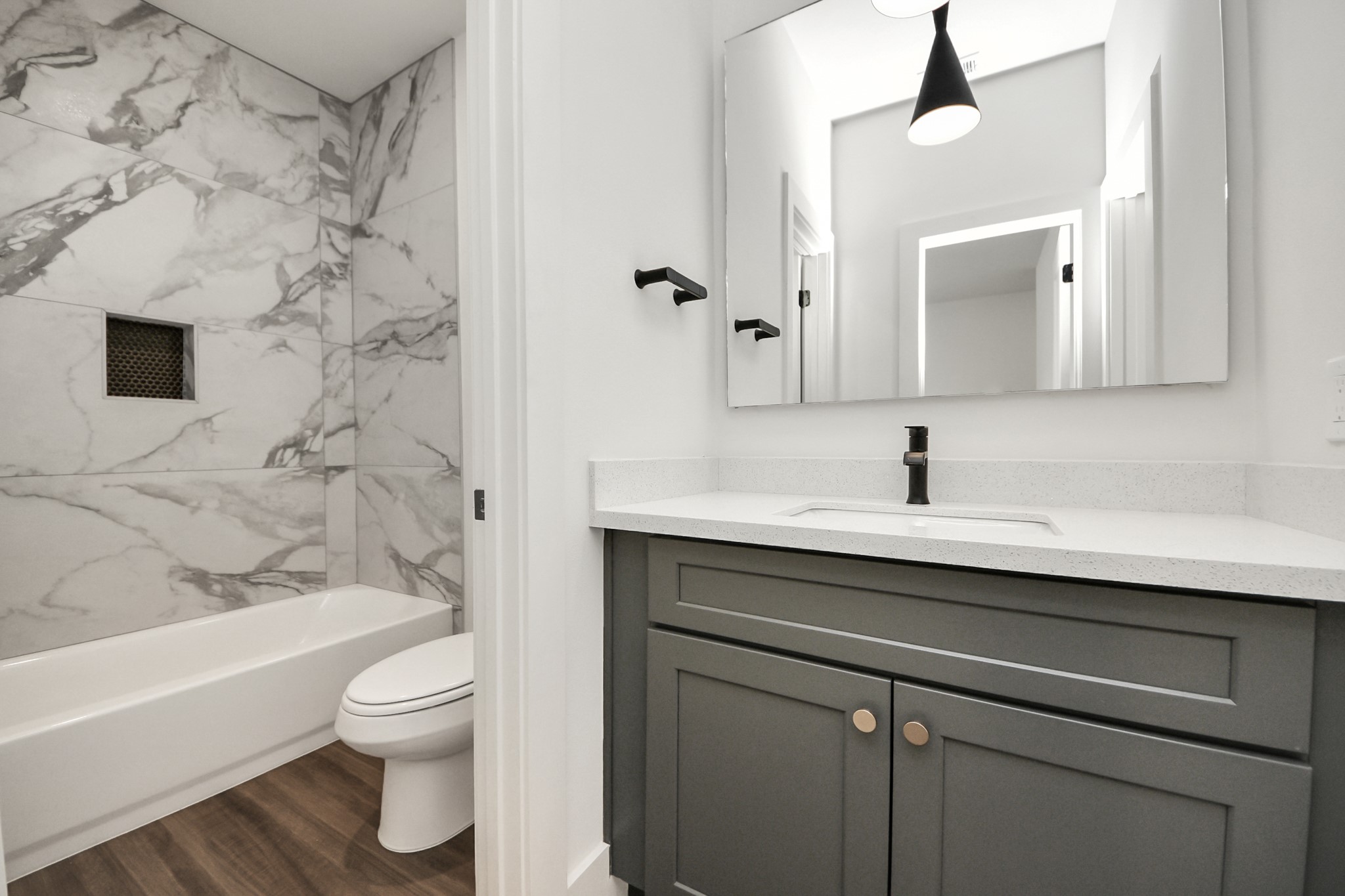 6018 Knox Street Houston, TX 77091 - Photo 25 of 42 a bathroom with a sink and a mirror