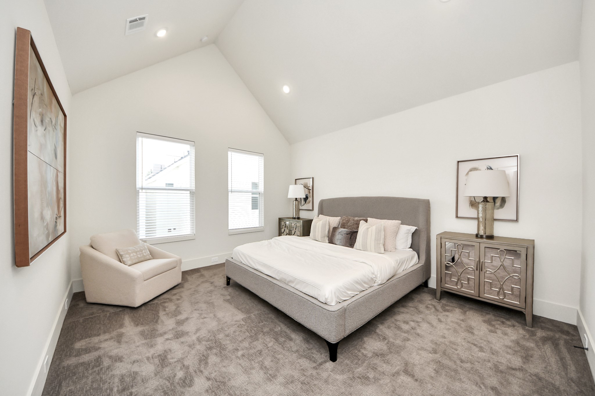 6018 Knox Street Houston, TX 77091 - Photo 31 of 42 a spacious bedroom with a bed and a couch