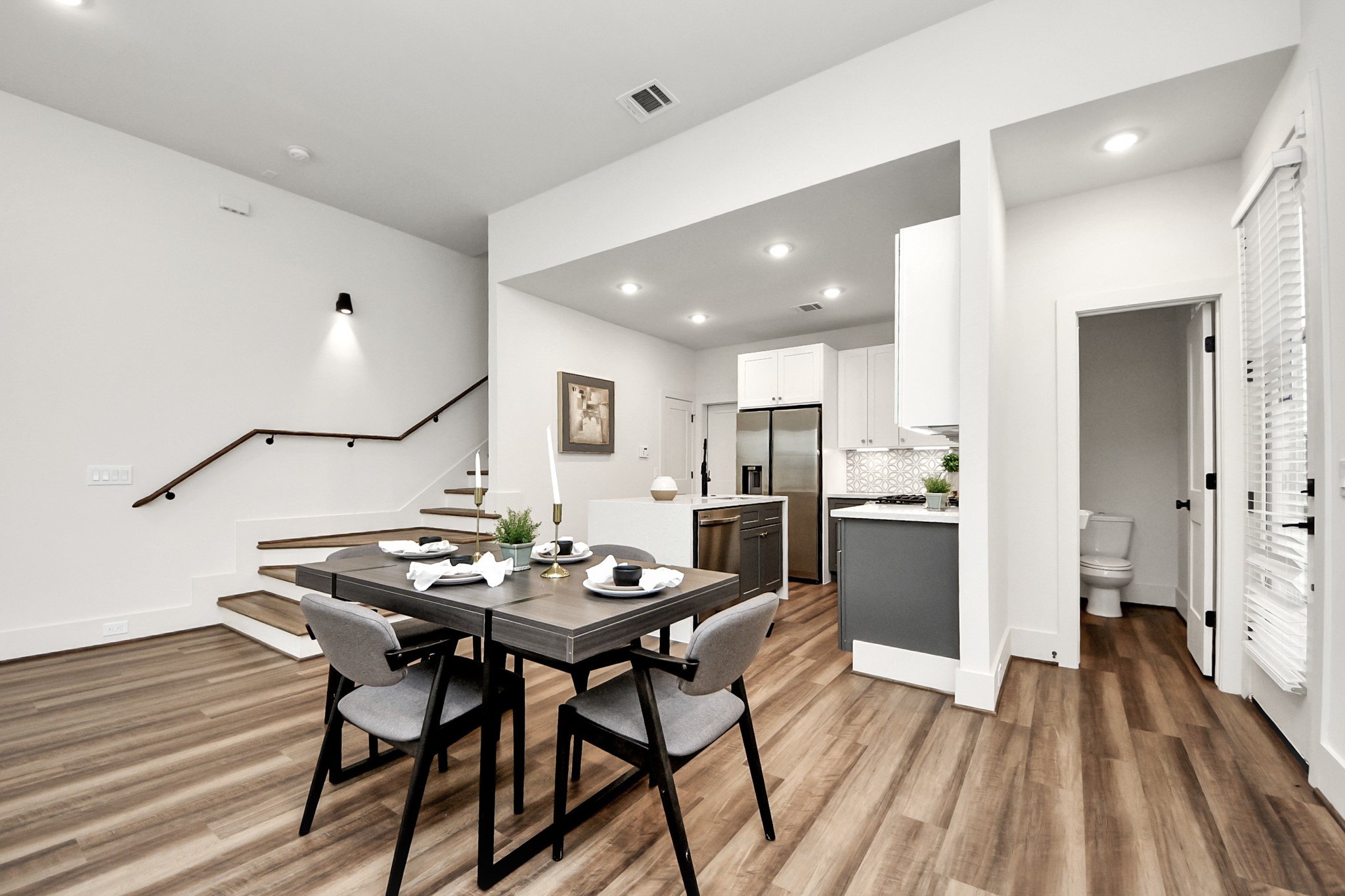 6018 Knox Street Houston, TX 77091 - Photo 10 of 42 a view of a dining room with furniture and wooden floor