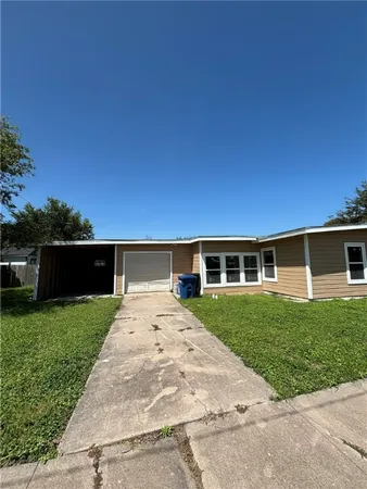 a view of house with yard