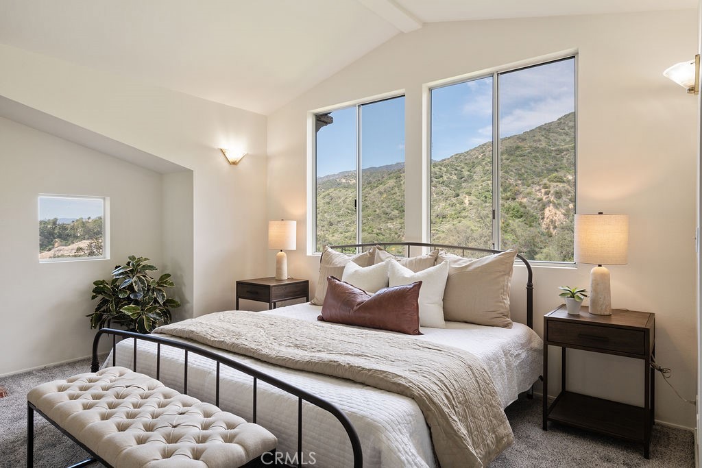 235 Spinks Canyon Road Duarte, CA 91010 - Photo 31 of 62 a bedroom with a large bed and a window
