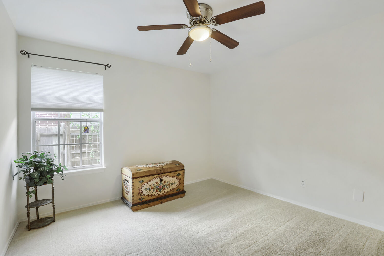 206 Gann Street Georgetown, TX 78626 - Photo 16 of 19 a room with a cabinet and a chandelier fan