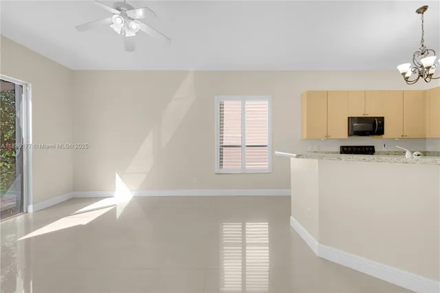 a view of livingroom with hardwood floor and a ceiling fan