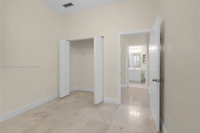 an empty room with mirror in it