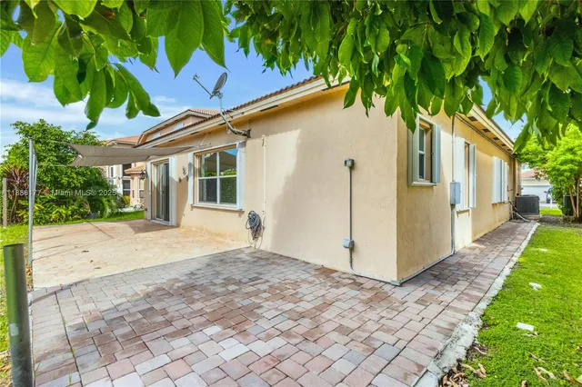 a house view with a backyard space