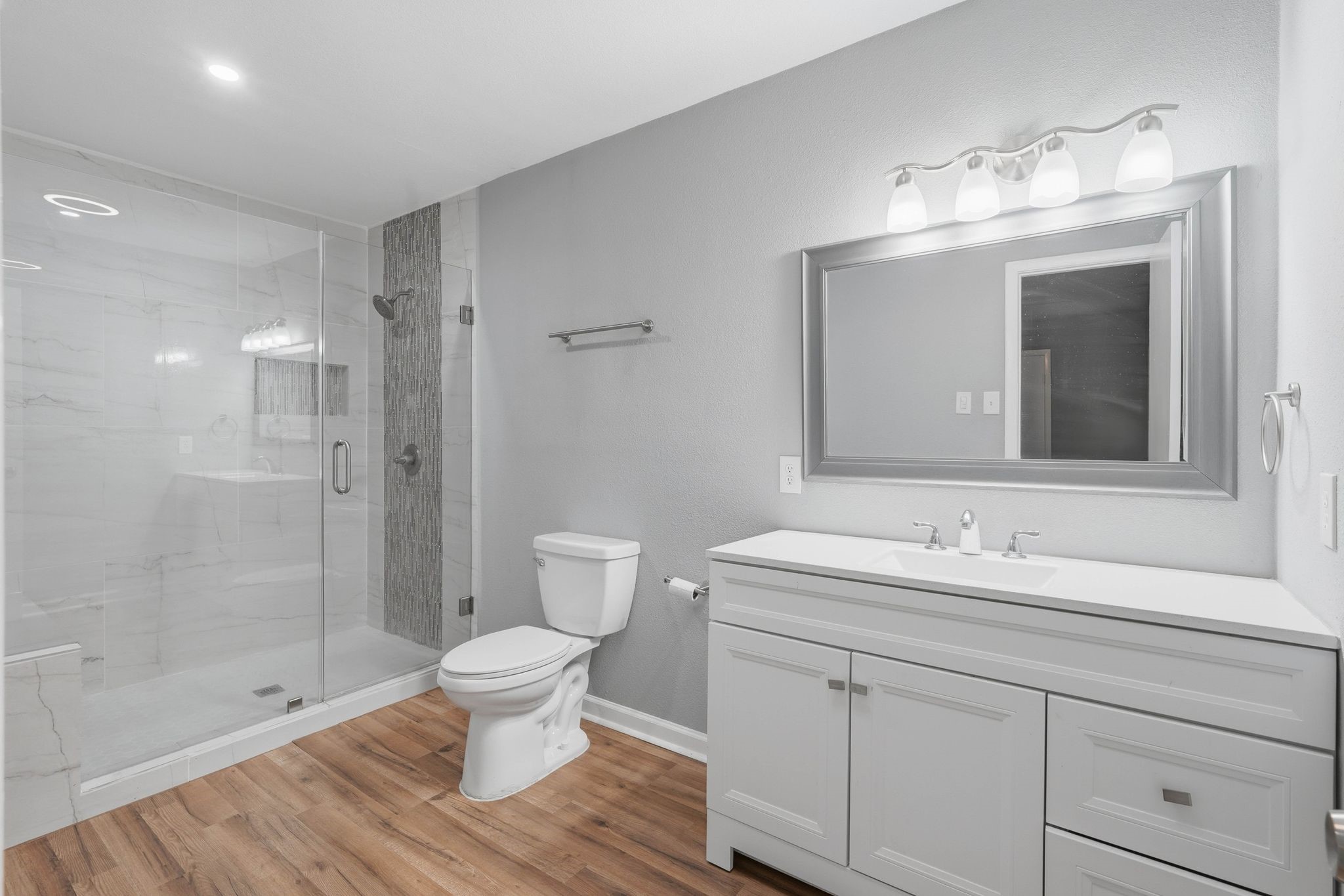 20 Moon Valley Court Conroe, TX 77304 - Photo 19 of 32 a bathroom with a sink a toilet and shower
