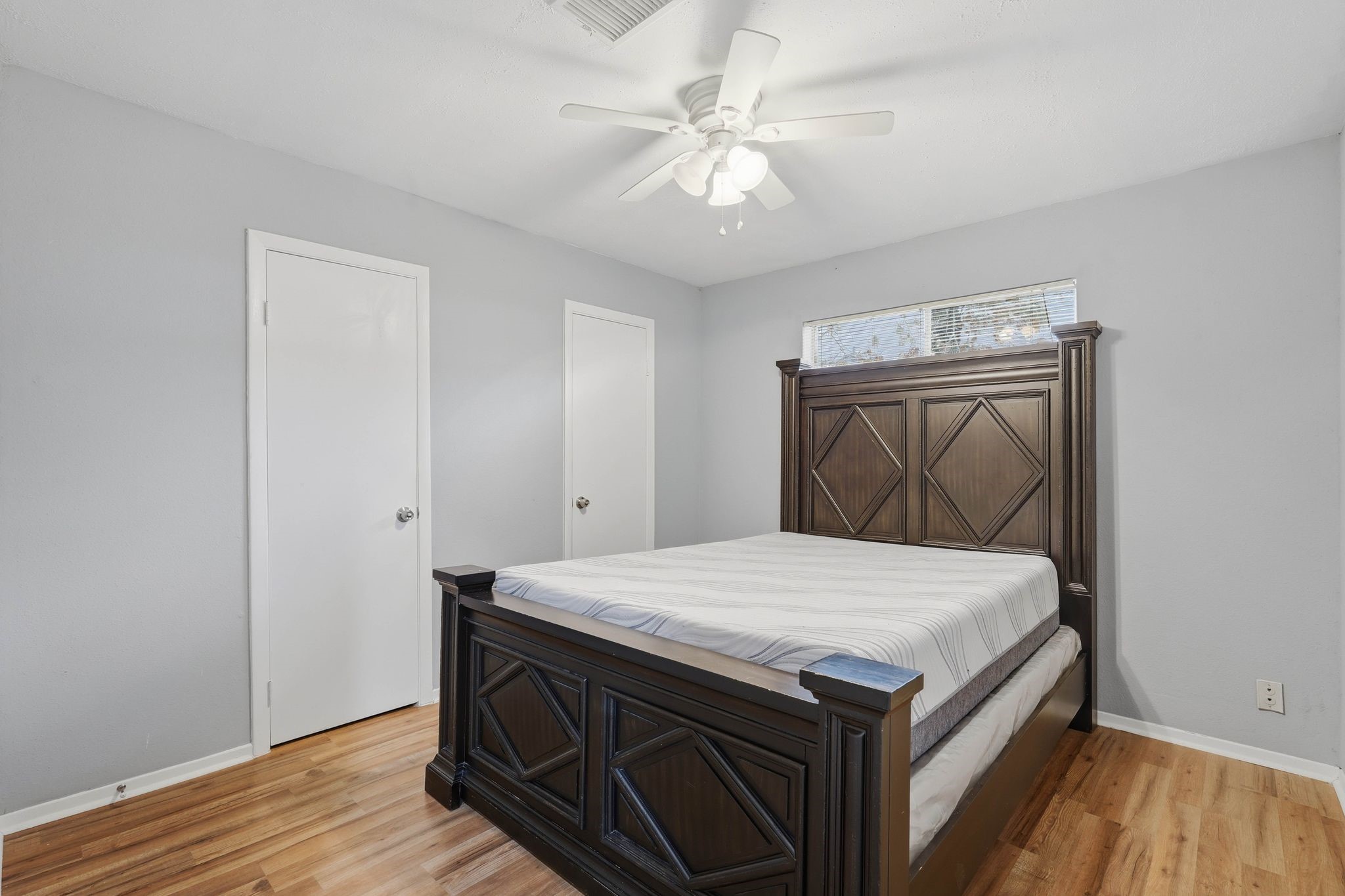 20 Moon Valley Court Conroe, TX 77304 - Photo 21 of 32 a bedroom with a bed and a dresser