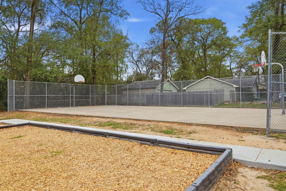 20 Moon Valley Court Conroe, TX 77304 - Photo 29 of 32 a view of a backyard