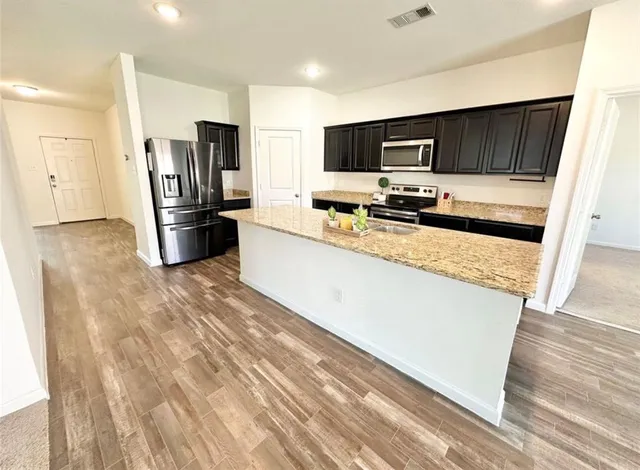 a view of empty room with ceiling fan