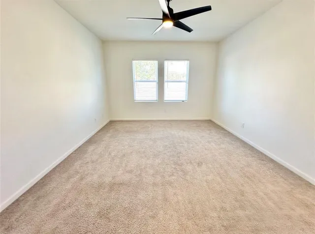 a bathroom with a sink a toilet a mirror and shower