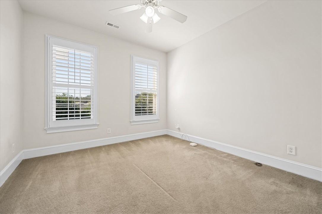 38 Angus Run Seneca, SC 29672 - Photo 22 of 46 This airy room offers comfort and serene views, perfect for peaceful living.