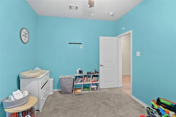 a living room with furniture and a chair