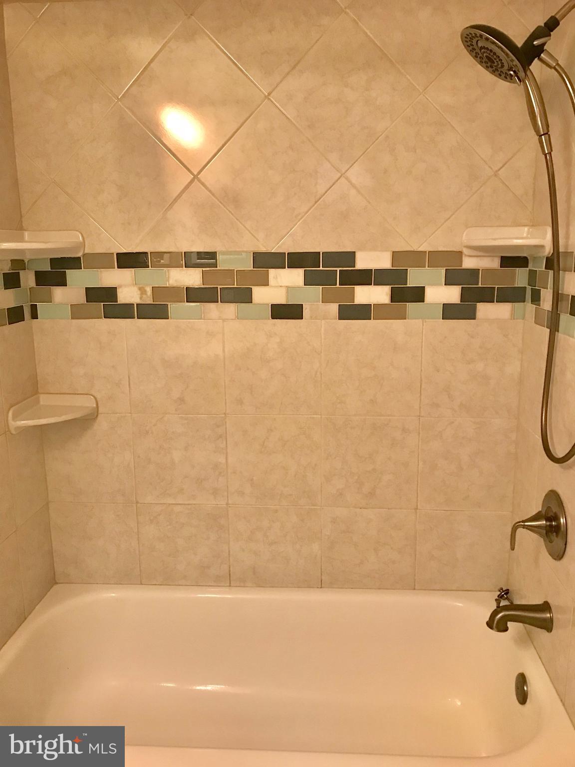 7702 Lexton Place, Unit 65 Springfield, VA 22152 - Photo 16 of 24 a bathroom with a bathtub