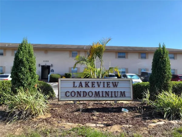 a sign that is sitting in front of a house