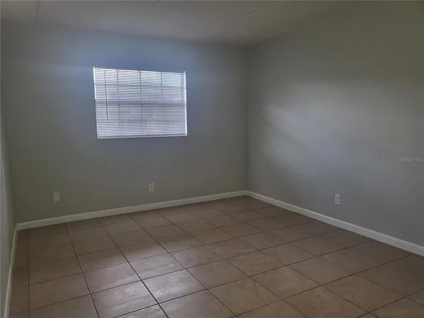 an empty room with a empty space and window
