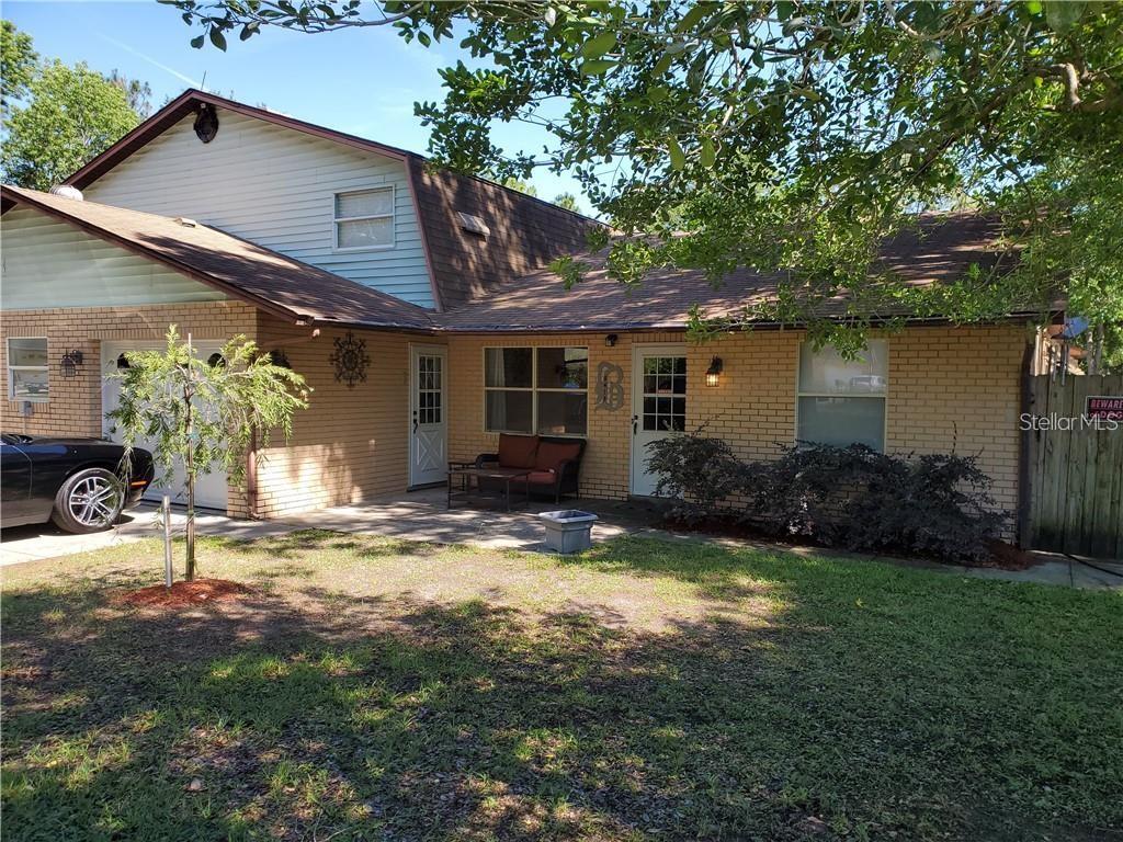 8413 Southwest 101st Place Road Ocala, FL 34481 - Photo 1 of 1 a view of a house with backyard and garden
