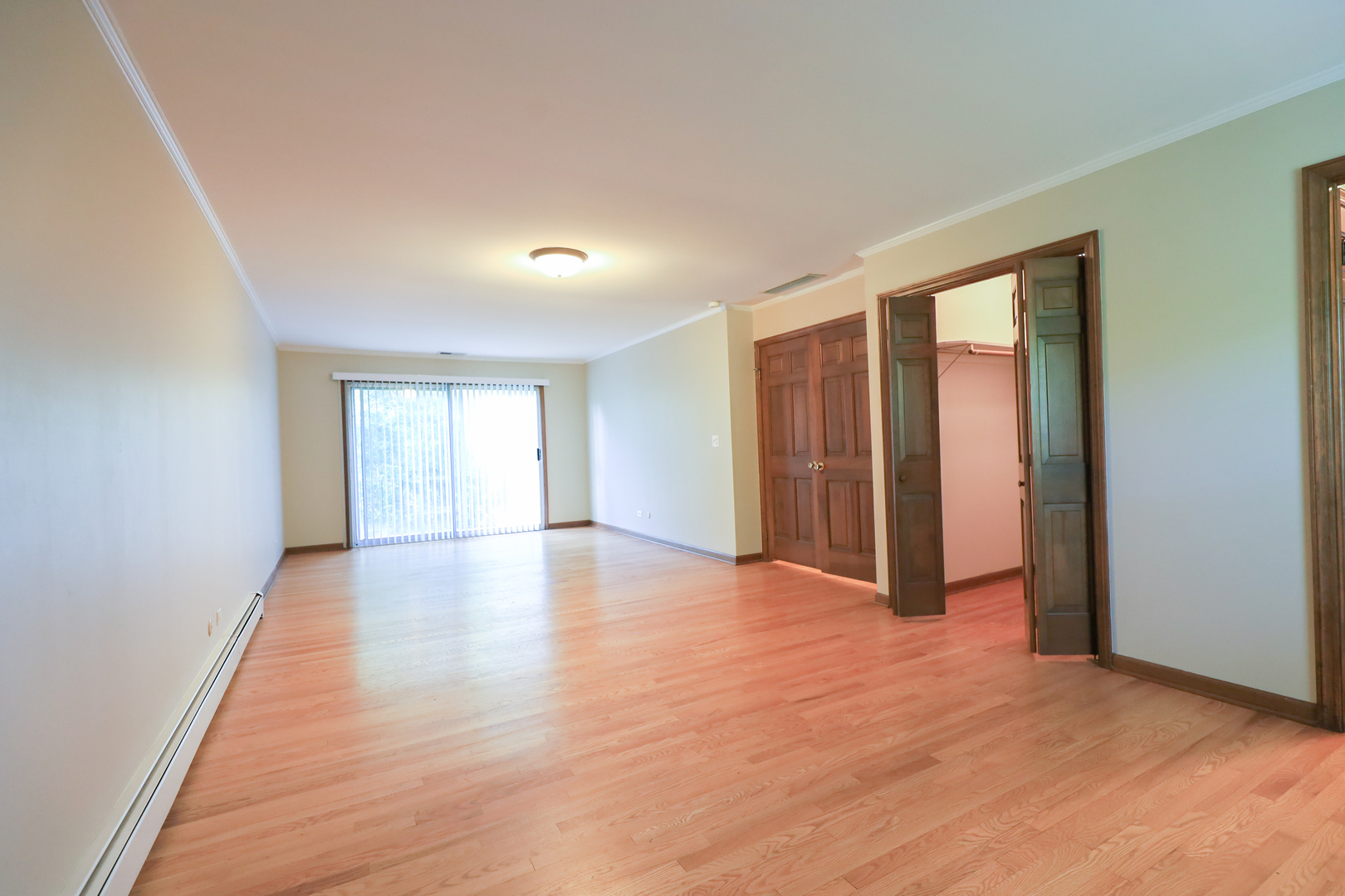 248 Florence Road Inverness, IL 60010 - Photo 13 of 25 a view of an empty room with wooden floor and a window