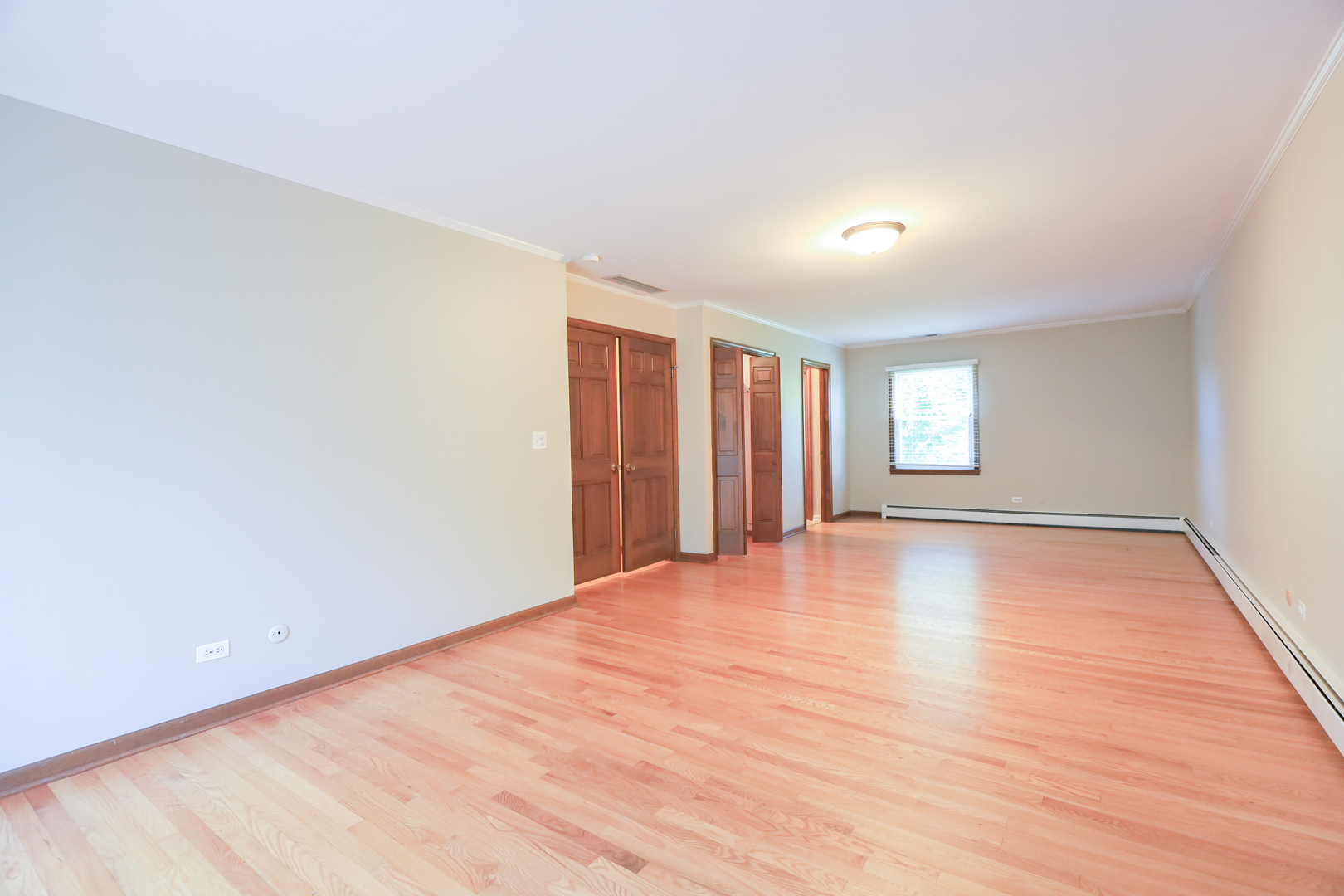 248 Florence Road Inverness, IL 60010 - Photo 14 of 25 an empty room with wooden floor and windows