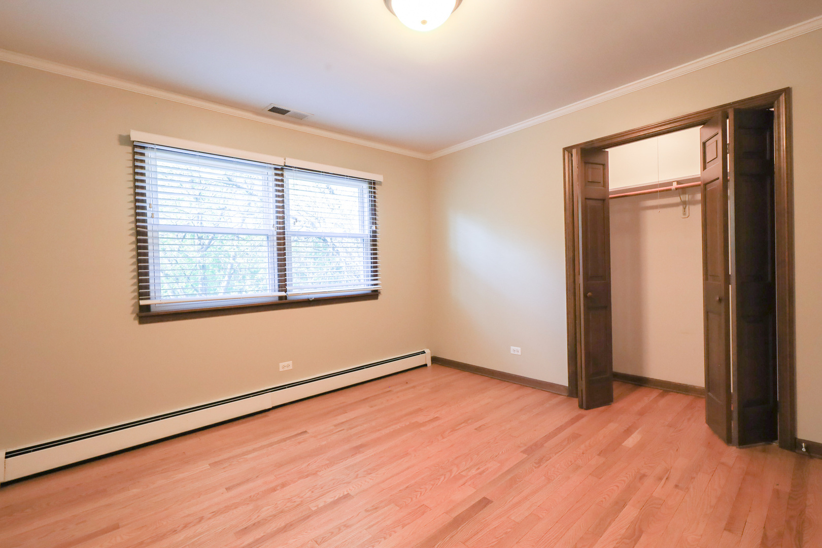 248 Florence Road Inverness, IL 60010 - Photo 21 of 25 an empty room with wooden floor and windows