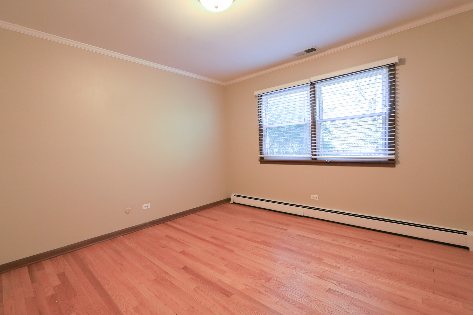 248 Florence Road Inverness, IL 60010 - Photo 22 of 25 an empty room with wooden floor and windows