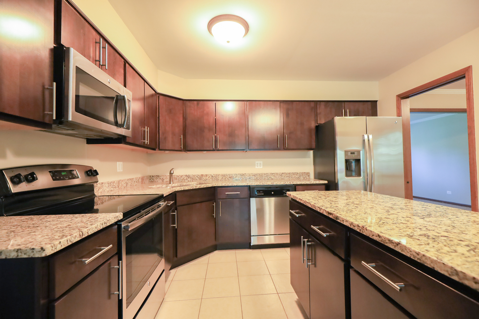 248 Florence Road Inverness, IL 60010 - Photo 7 of 25 a kitchen with stainless steel appliances granite countertop a sink stove and refrigerator