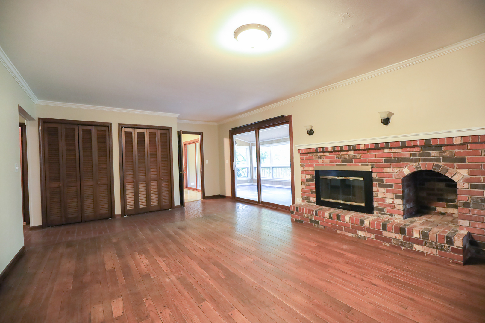 248 Florence Road Inverness, IL 60010 - Photo 8 of 25 an empty room with floor to ceiling window and fireplace