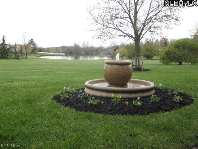 7407 Cedar Road Chesterland, OH 44026 - Photo 6 of 25 Sit on the veranda & listen to the sound of the water from this fountain as you just relax or entertain company.