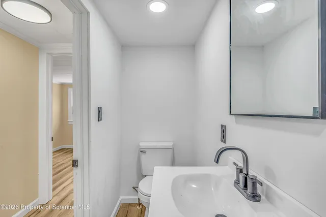 a bathroom with a sink and mirror