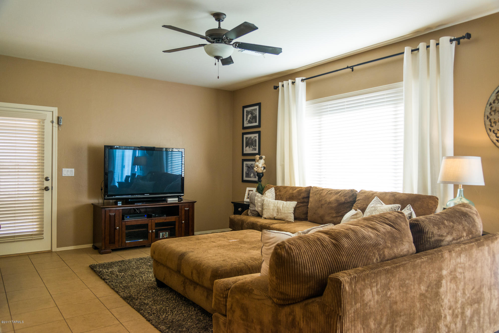 4405 West Crystal Ranch Place Marana, AZ 85658 - Photo 11 of 44 a bedroom with a bed and a flat screen television