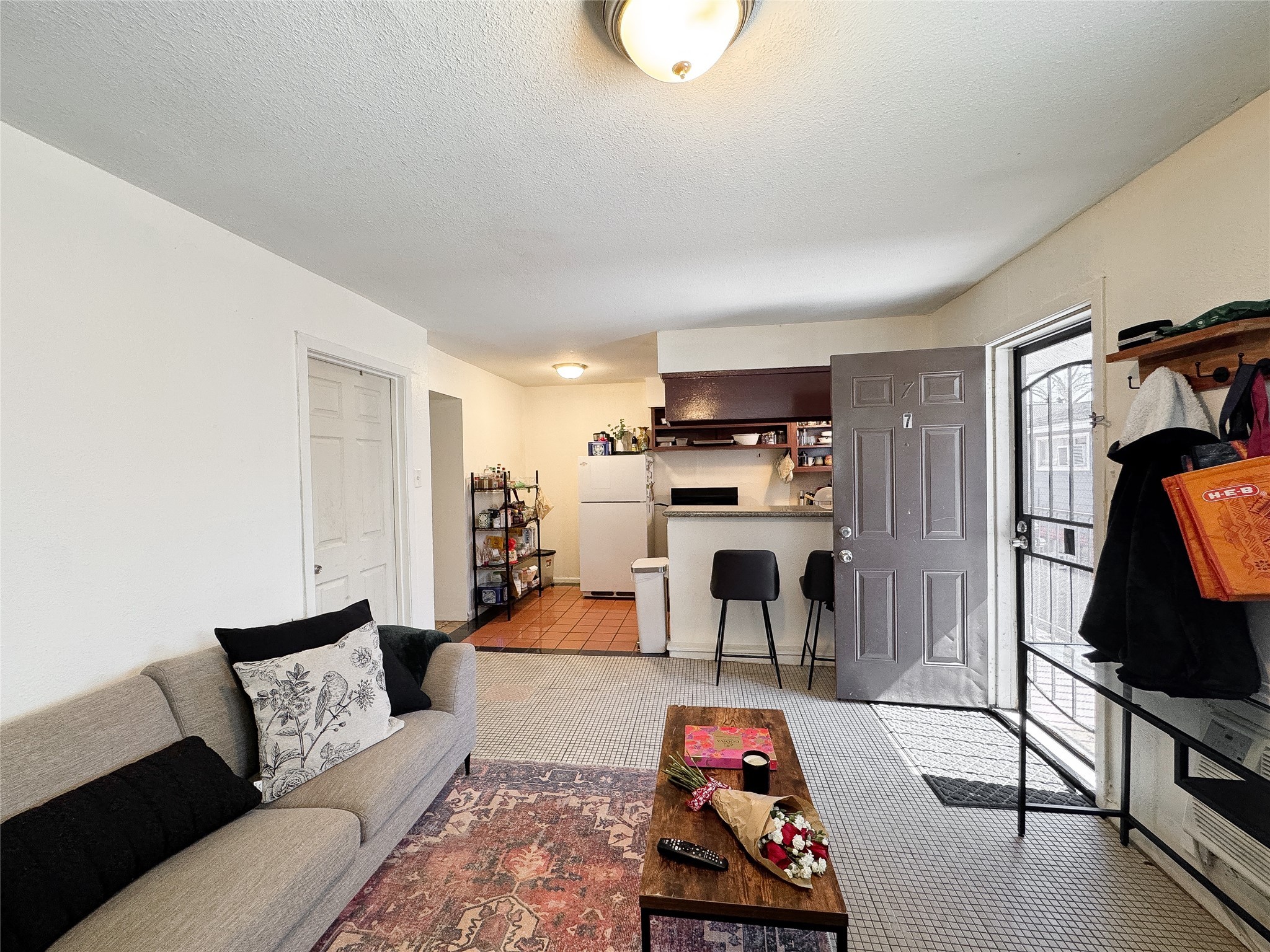 2712 Oakcliff Street Houston, TX 77023 - Photo 12 of 30 a living room with furniture and a flat screen tv