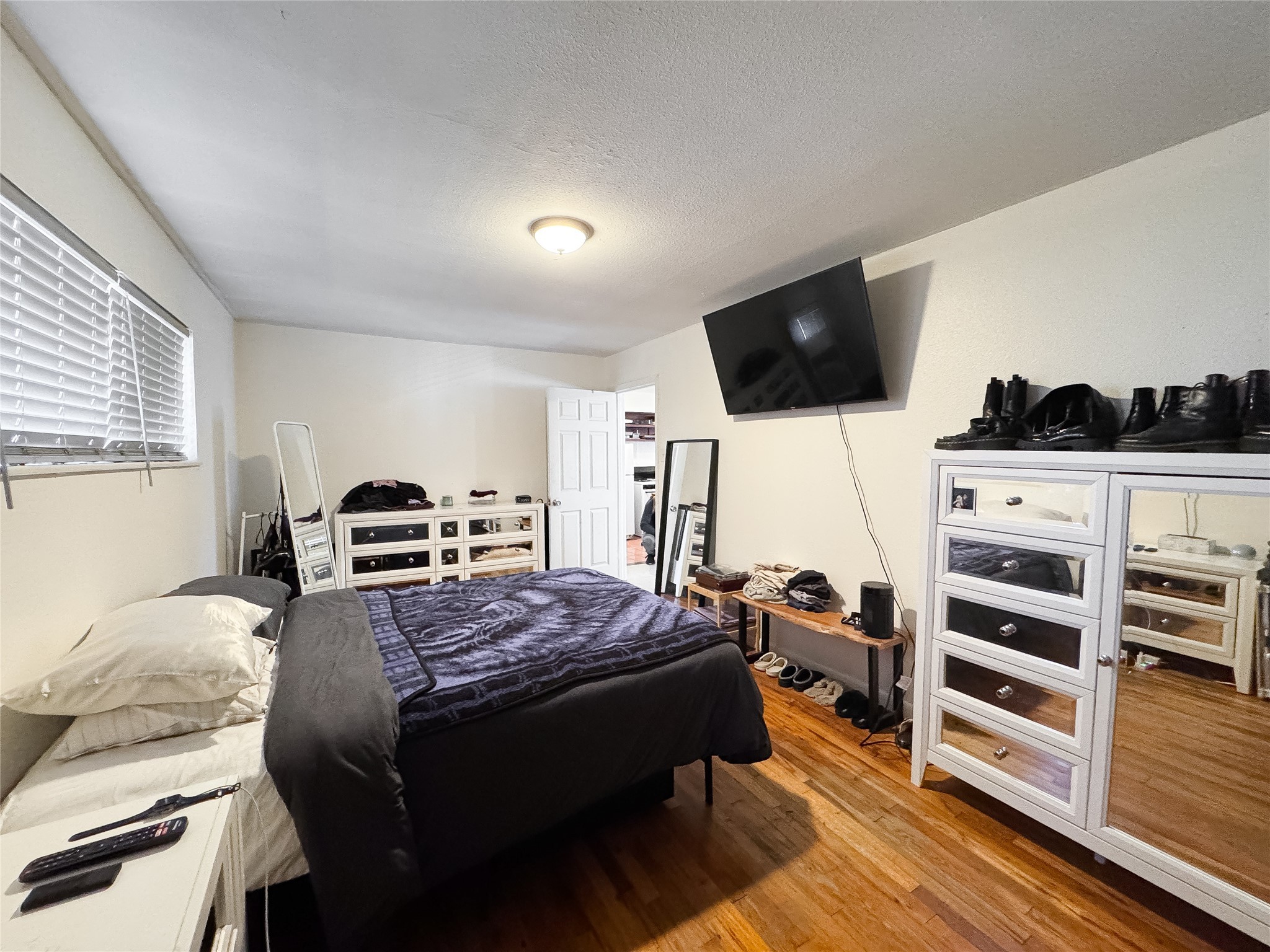 2712 Oakcliff Street Houston, TX 77023 - Photo 15 of 30 a bedroom with a bed and flat screen tv