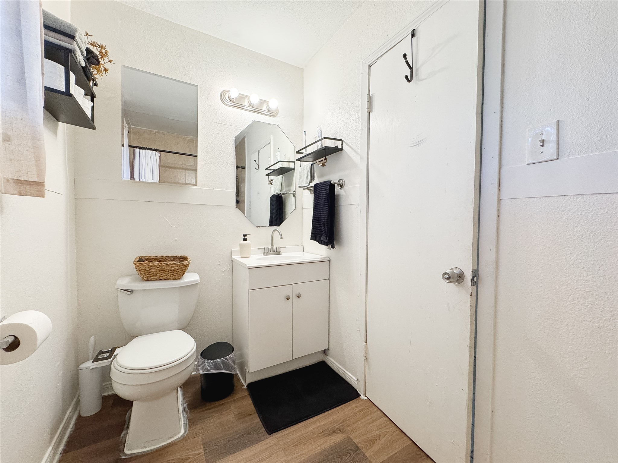 2712 Oakcliff Street Houston, TX 77023 - Photo 16 of 30 a bathroom with a toilet sink and mirror
