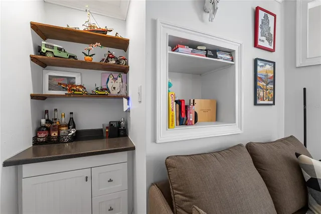 a bedroom with a bed and book shelf