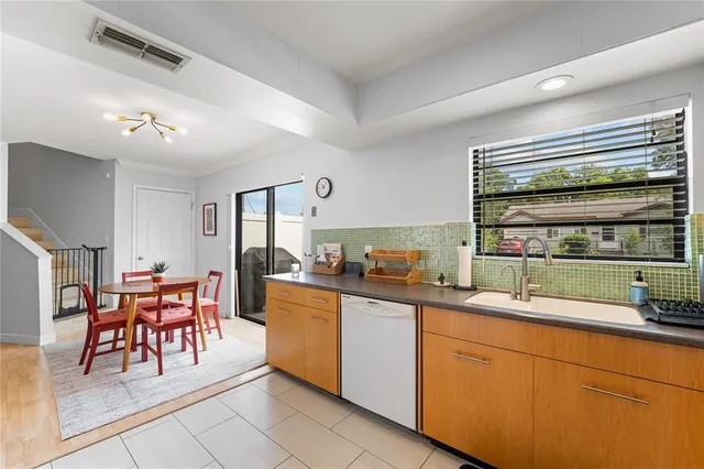 a kitchen with lots of counter top space and dining table