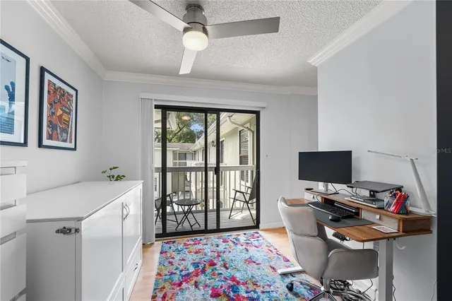 a bedroom with a workspace