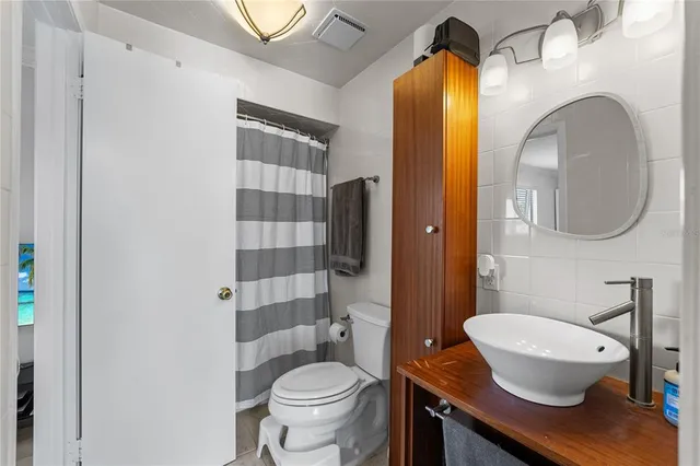 a view of a workspace with furniture and wooden floor