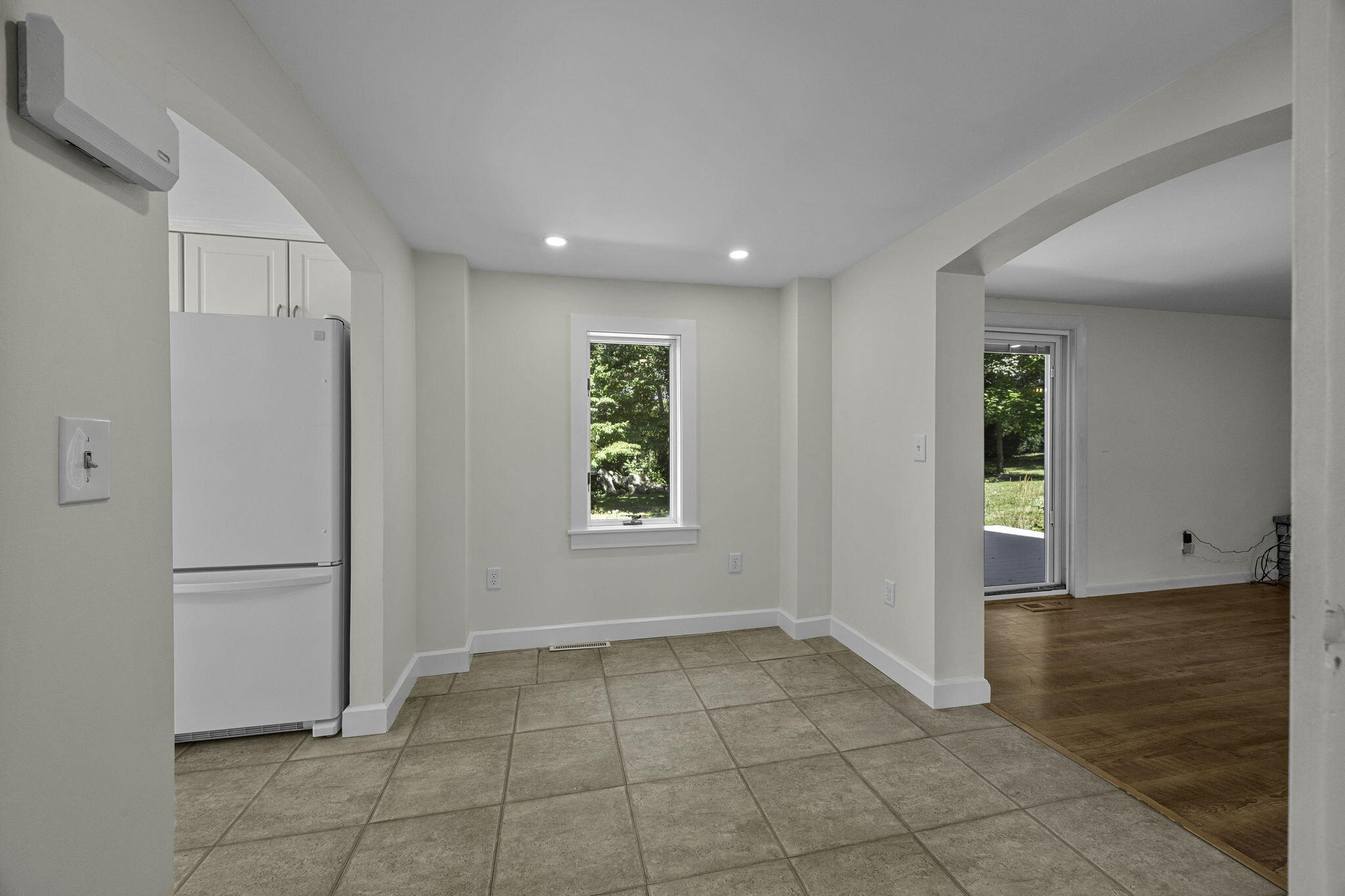 20 Namskaket Road Orleans, MA 02653 - Photo 12 of 63 a view of an empty room with window and refrigerator