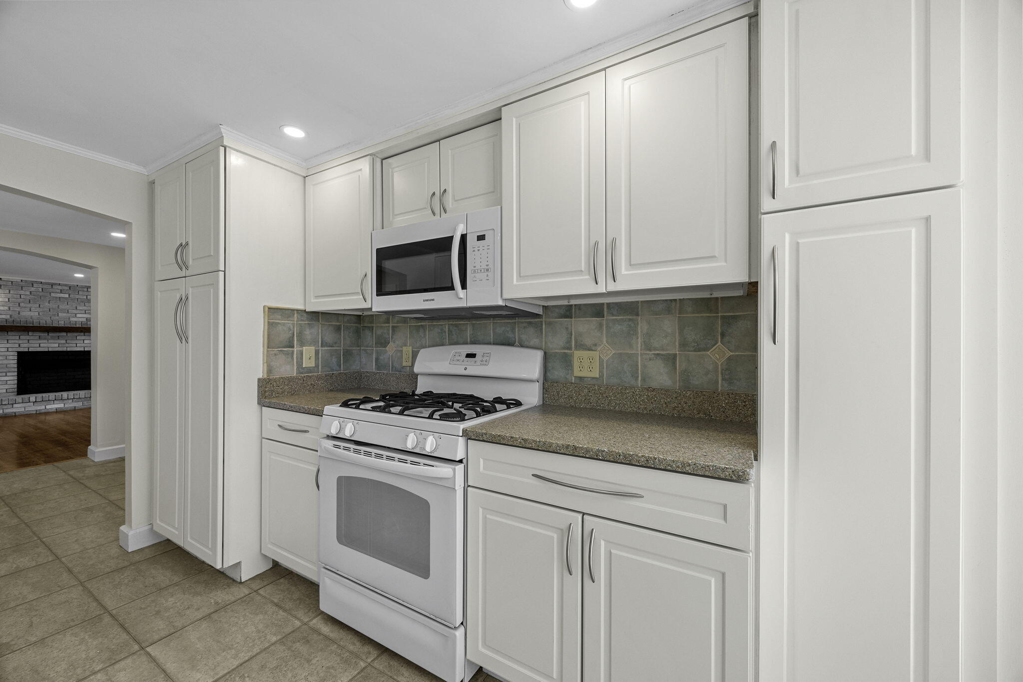 20 Namskaket Road Orleans, MA 02653 - Photo 17 of 63 a kitchen with white cabinets and appliances